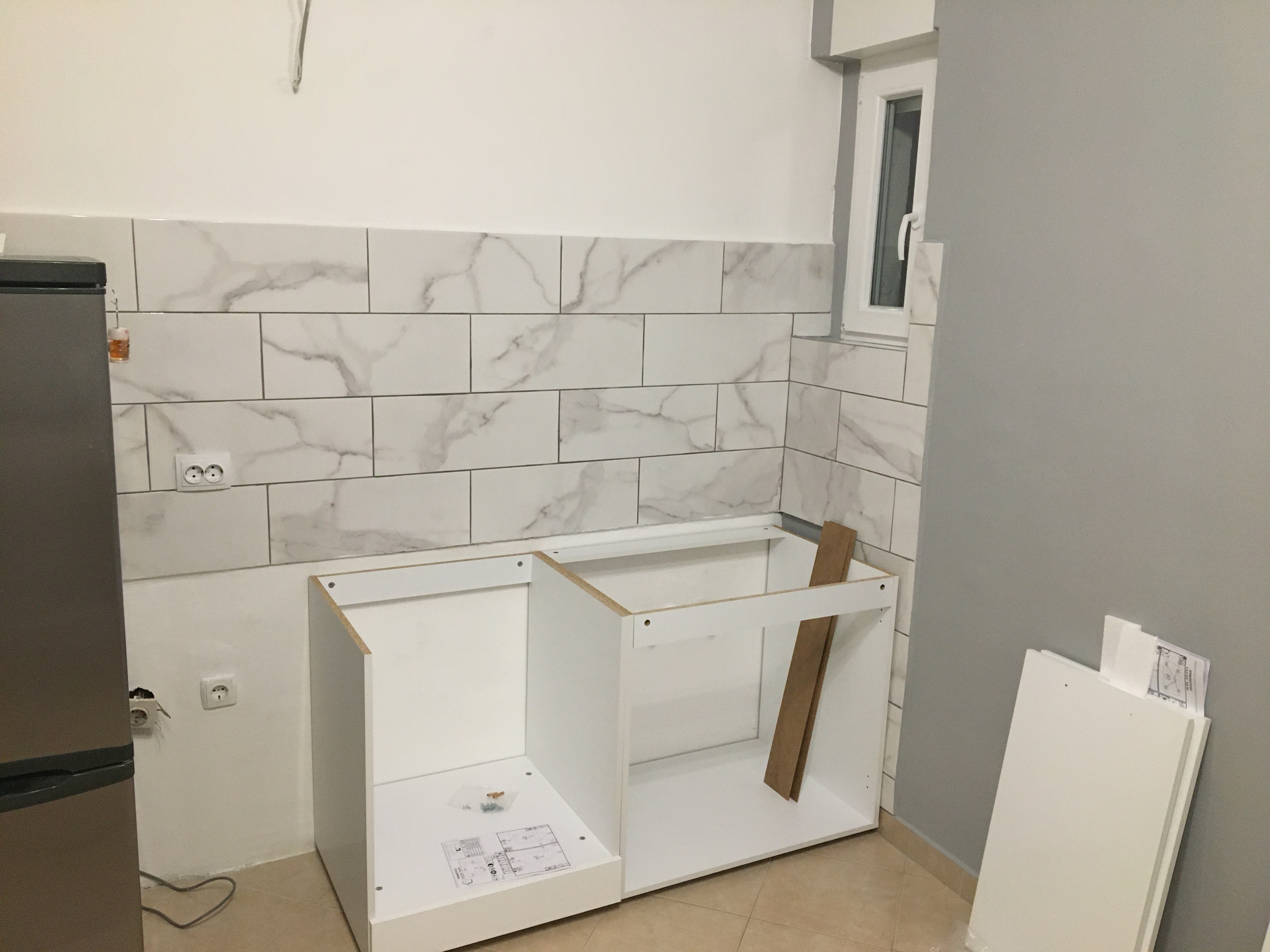 young boy sitting in barbers chair