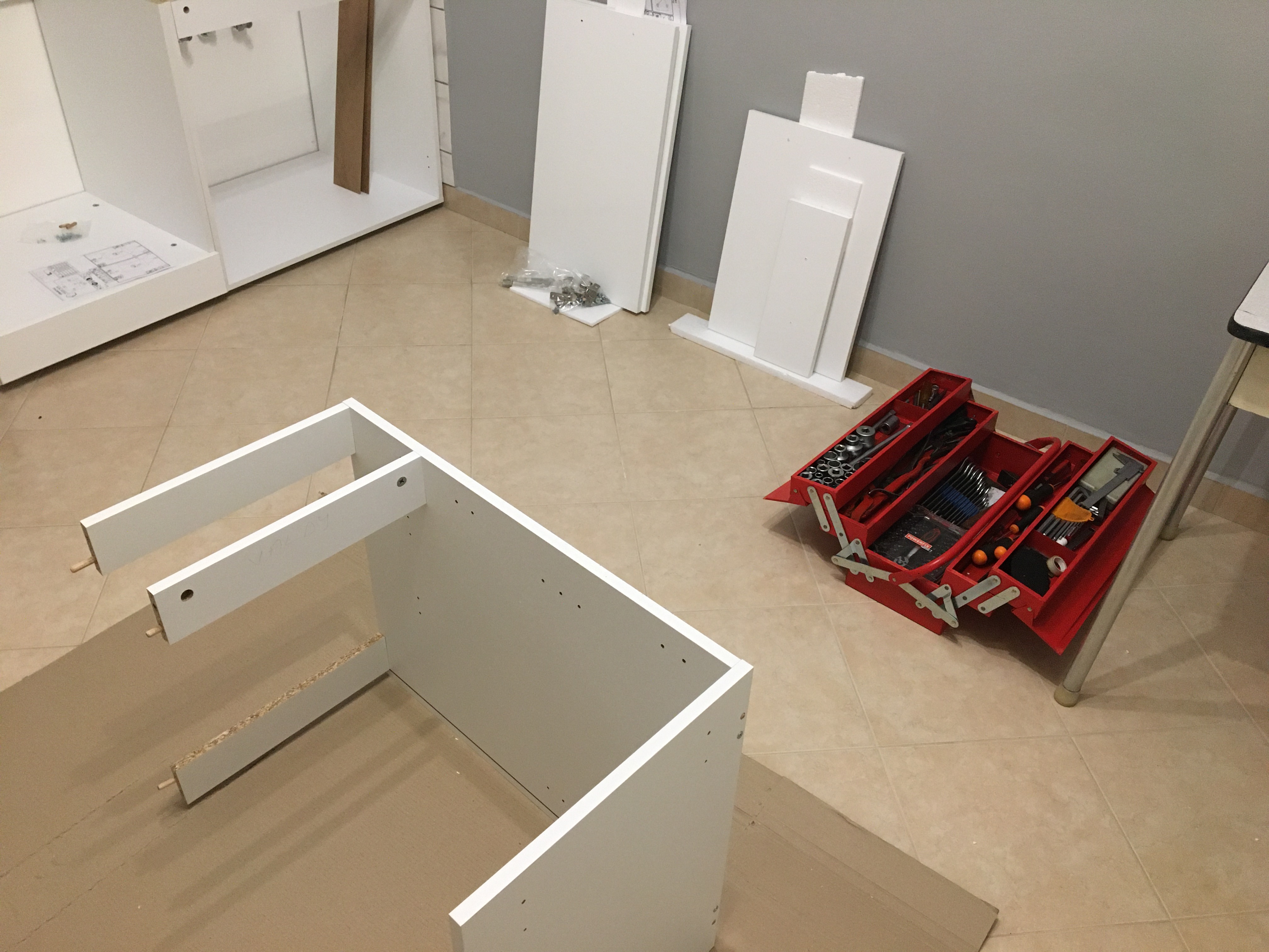 young man side profile having beard trimmed with scissors